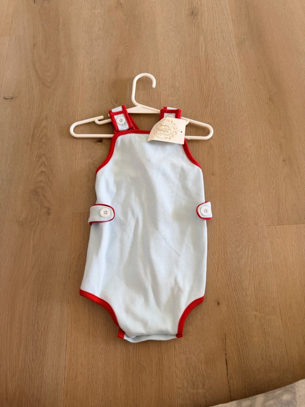 The Beaufort Bonnet Company blue sunsuit with Red Trim